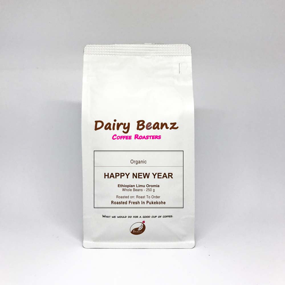 Custom Coffee Gift Pack with "Happy New Year" label on coffee bags, perfect for gifting.