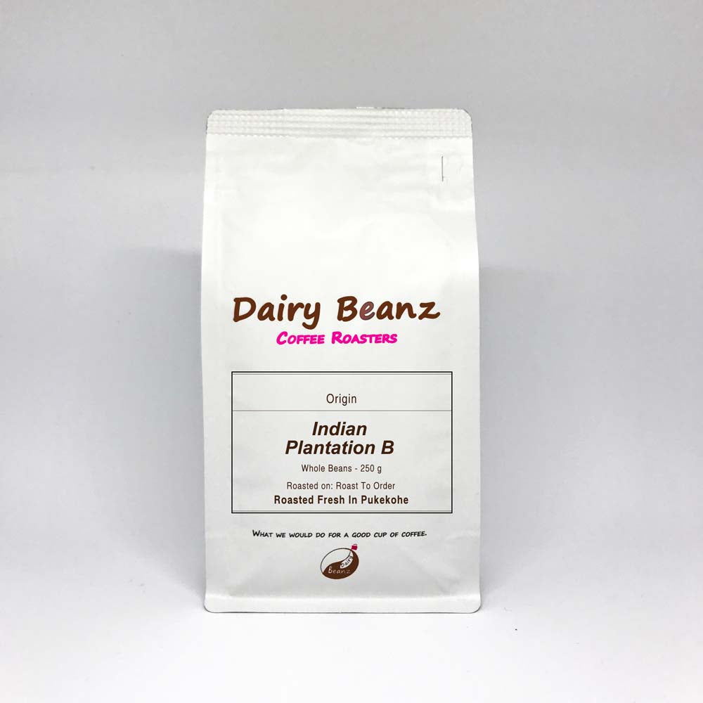 A bag of 'Indian PB' single origin coffee beans with simple and elegant packaging design.