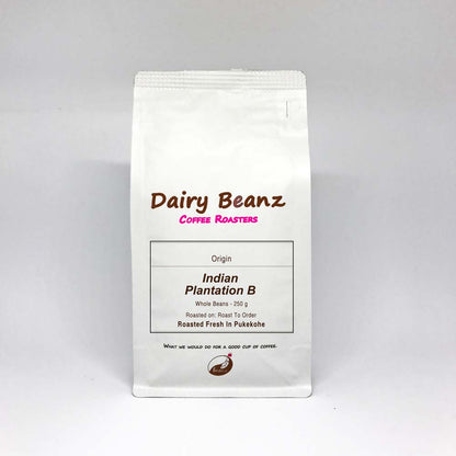 A bag of 'Indian PB' single origin coffee beans with simple and elegant packaging design.